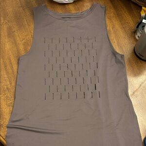 Reebok mauve laser cut tank top features a unique ventilated design